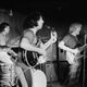 American rock band The Grateful Dead is shown on stage in 1970. The photo is in black and white.